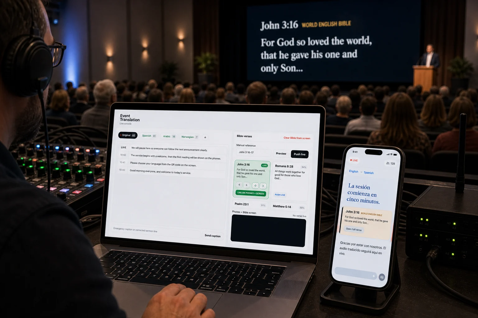 A church booth running Koine, with John 3:16 shown on the main screen and the same verse on a listener's phone in Spanish.